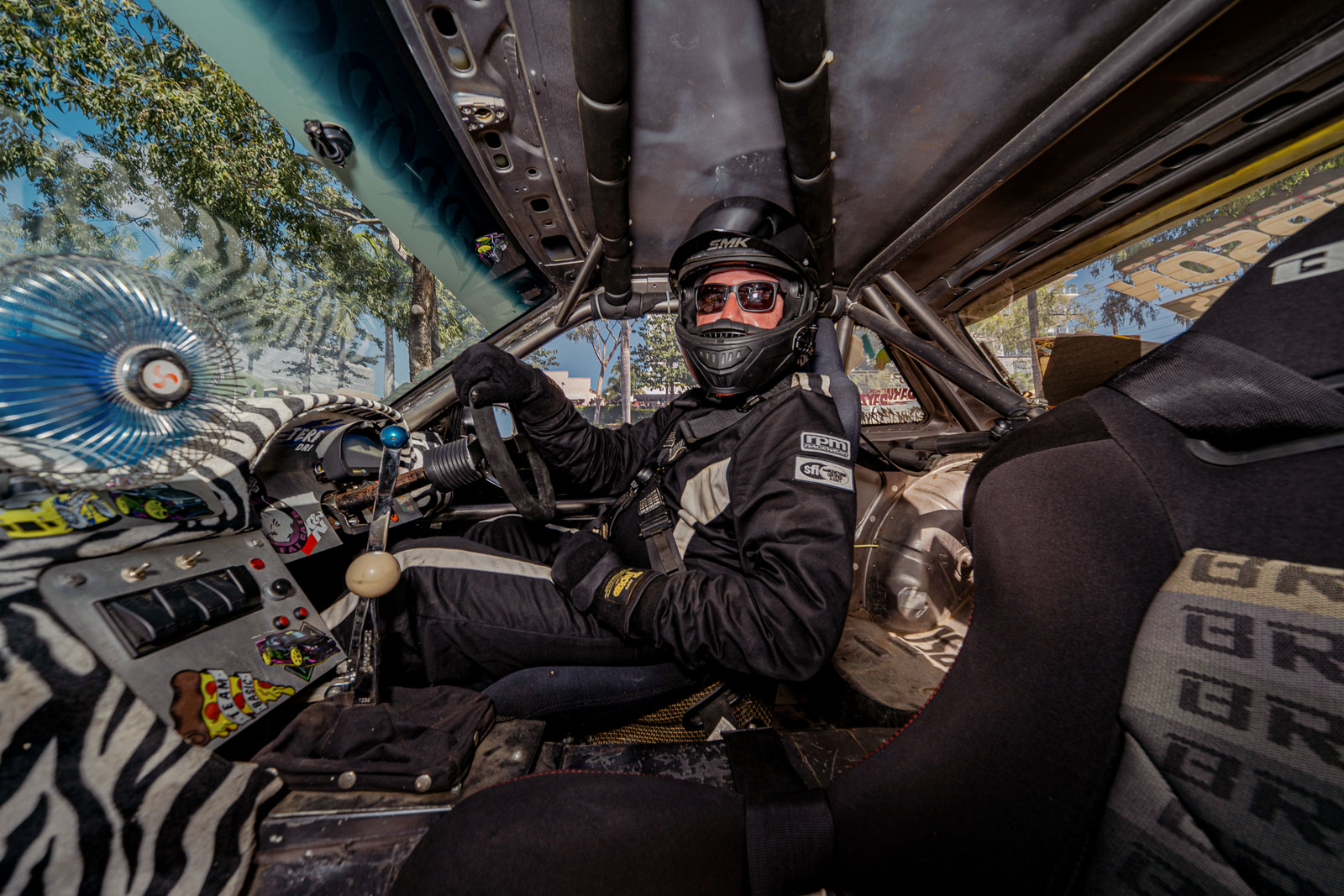 The view inside of a drifting car as you enter for a passenger ride 'hot laps'
