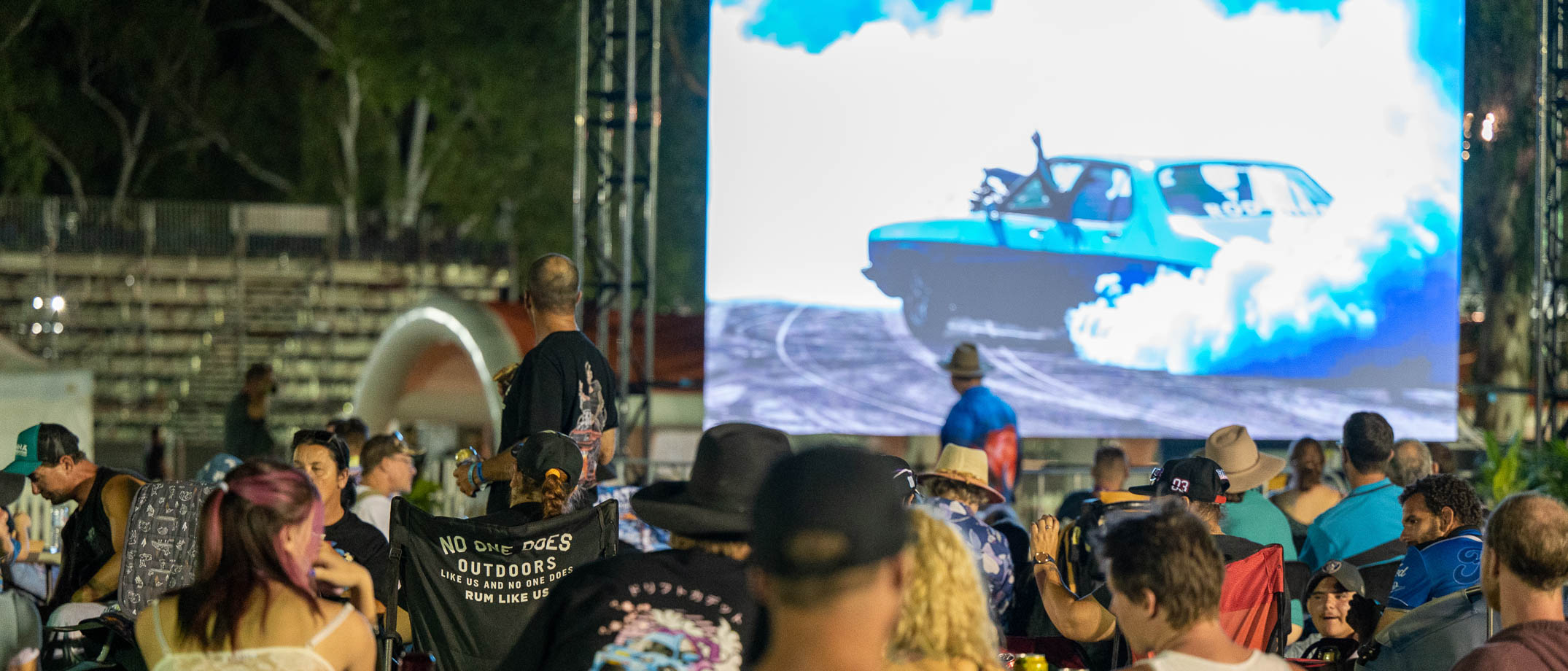 Patrons watching burnouts on the big screen at the Burnout Zone