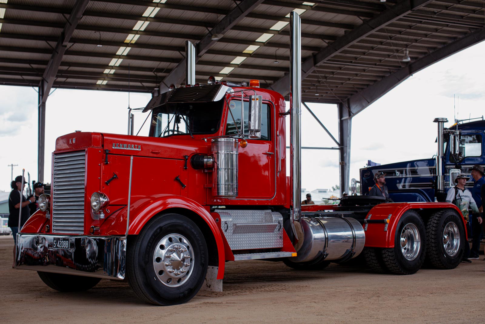 A classic red Kenworth show truck on display inside the Showgrounds Precinct at Rockynats 06, with visitors viewing the Big Truck Display